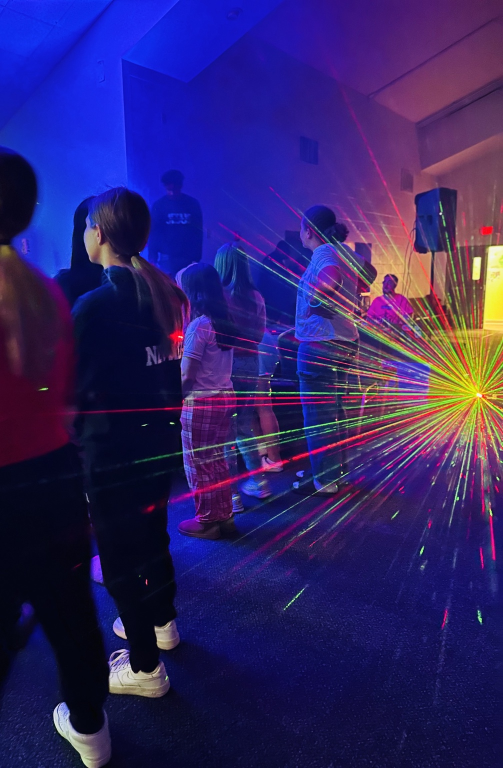 Students gathering in a colorful event room